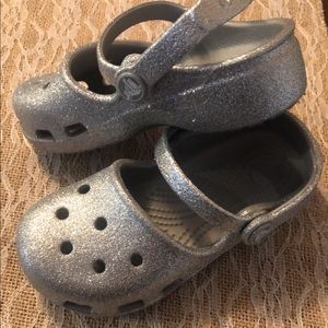 Girls sparkle crocs.